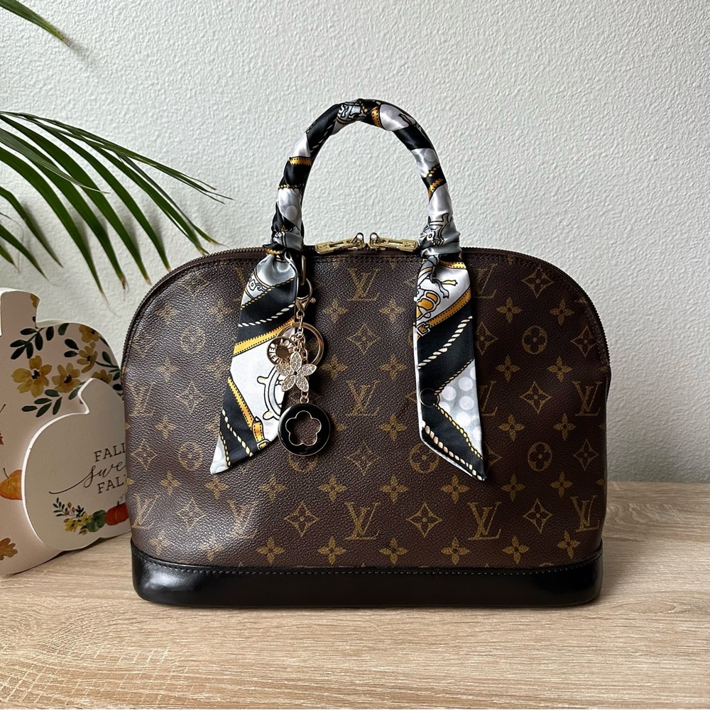 Louis Vuitton Brown Monogram Alma Handbag with Black Trim and Gold Hardware